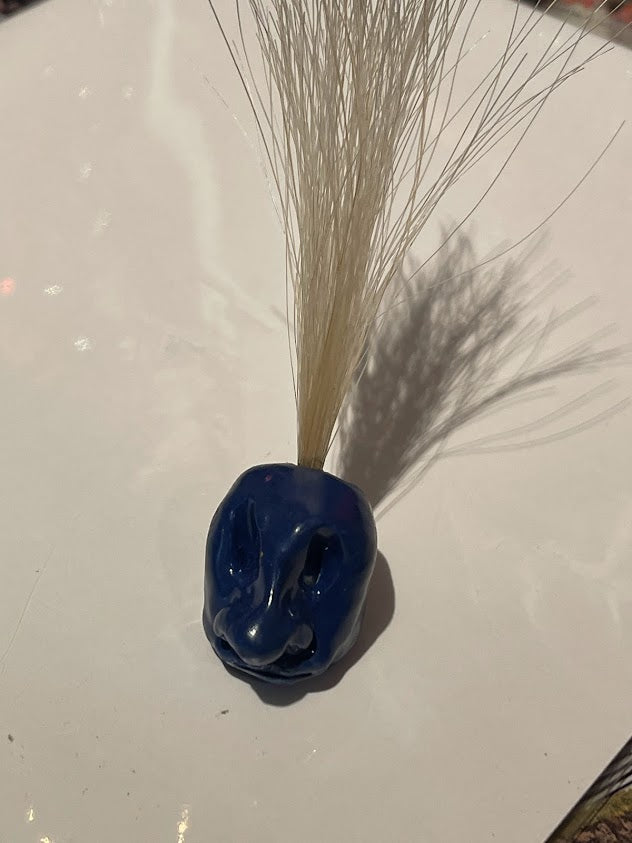 Tiny Blue Hairy Head